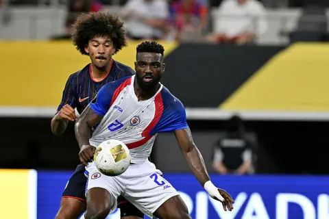 Haiti'de Futbolun Gücü: Karanlıktaki Tek Işık Dünya Kupası Oldu Haiti'de Futbolun Gücü: Karanlıktaki Tek Işık Dünya Kupası Oldu